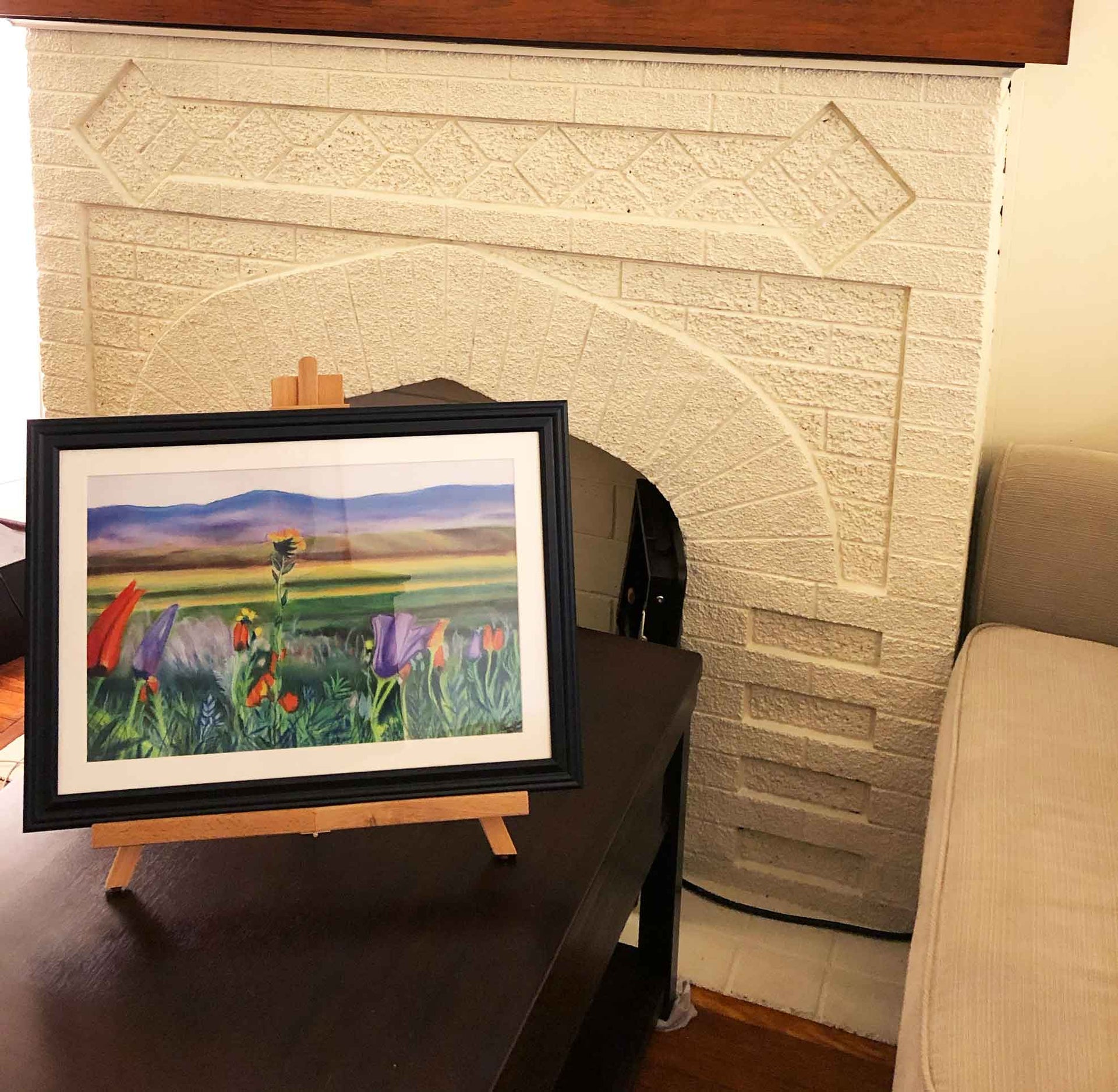 An example of the print of Arizona Poppies in a black frame with a white mat