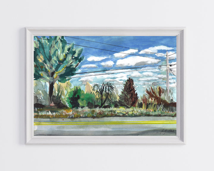 A photo of a giclee print of trees alongside a backroad in rural country