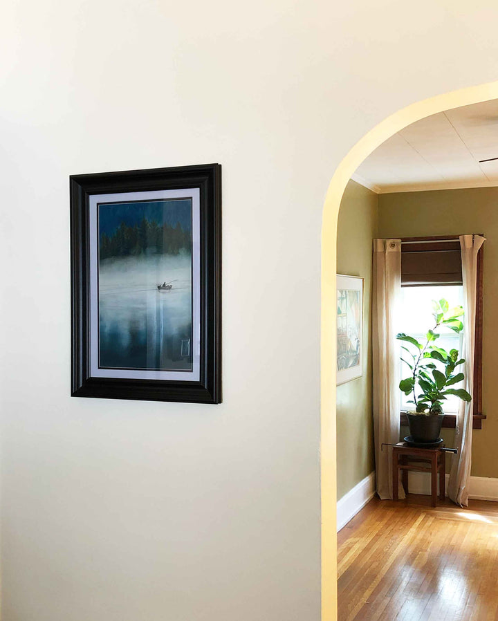 The Fisherman and his dog giclee print displayed on the wall in a home