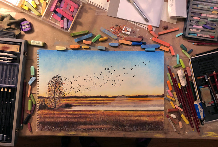 The in-progress painting of "Morning Rising" with birds taking flight out of tree, over a pond filled with rising mist.