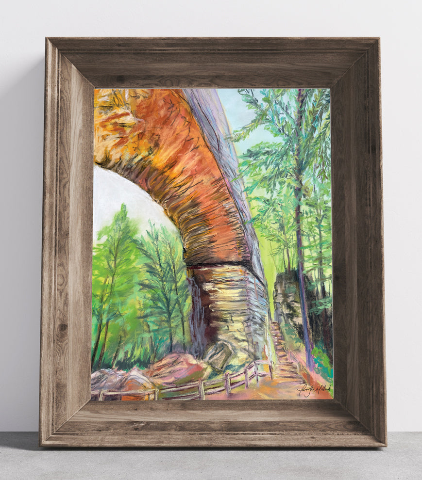 A giclee print of Natural Bridge and Fat Man's Squeeze in a wood frame.