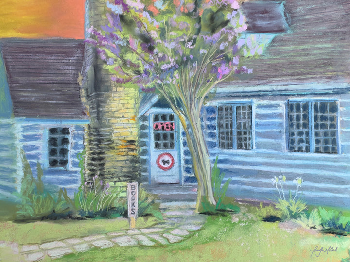 This soft pastel image depicts The Taleless Dog Booksellers building in soft blues and lavenders.