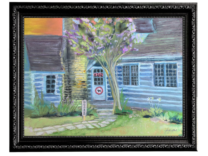 This soft pastel print of an old bookstore in a cottage is displayed in an ornate black frame.