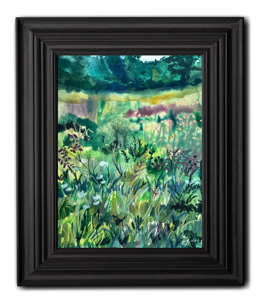 A fine art print of an abstract green meadow in a thick black frame.