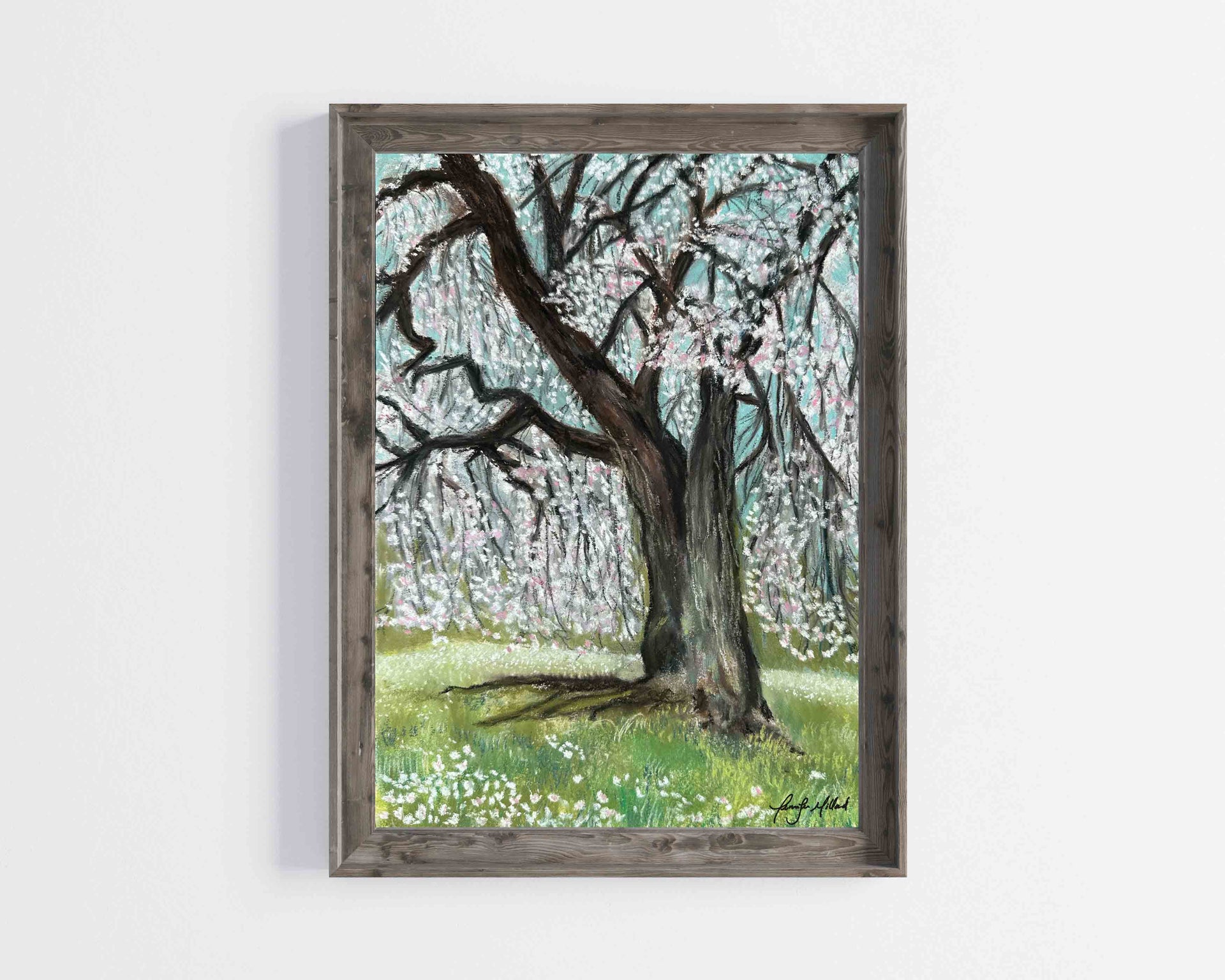 A weeping cherry tree is heavy with white and pink buds as they drop to the ground in this beautiful print displayed in a gray wood frame.